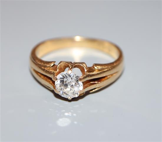 An early 20th century 18ct gold and claw set solitaire diamond ring (stone chipped), size P/Q.